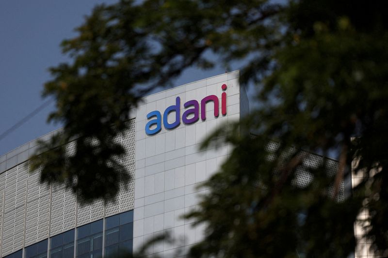 Adani hit by downgrades as projects under review in India, Sri Lanka