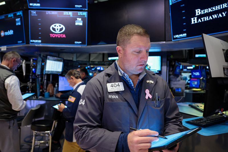 Wall Street stocks end lower after inflation data, tech stocks push Nasdaq down