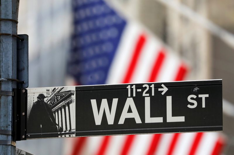 Wall St falls as strong holiday-shortened week nears close