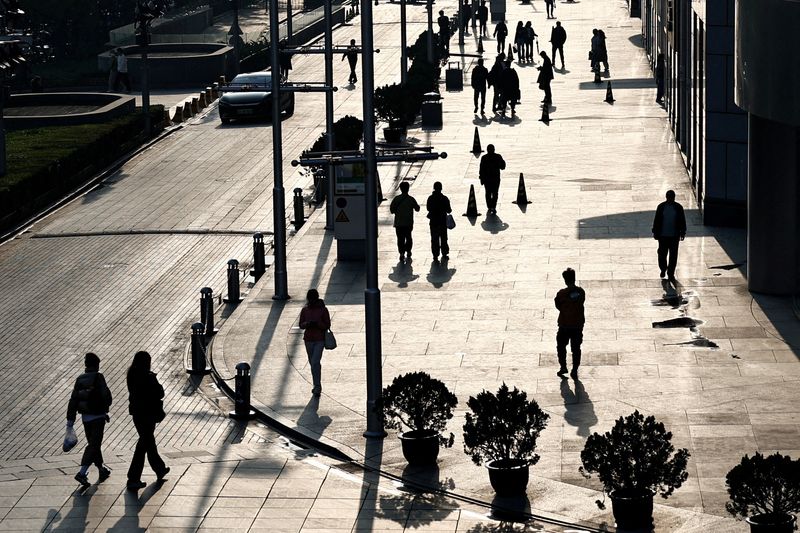 Chinese youth flock to civil service, but slow economy puts 'iron rice bowl' jobs at risk