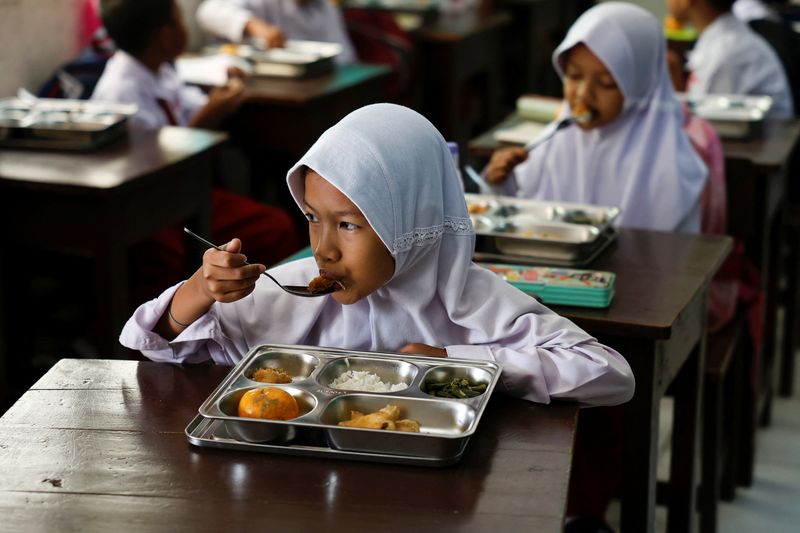 Indonesia dishes out first free meals in programme targeting 83 million people